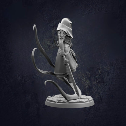 A 3D model of a character with a pointed hat and a long, flowing cape, holding a sword and standing on a rock.