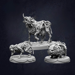 three sculptures of fantastical creatures, including a large, monstrous bull-like creature, a smaller, monstrous creature, and a pig-like creature.