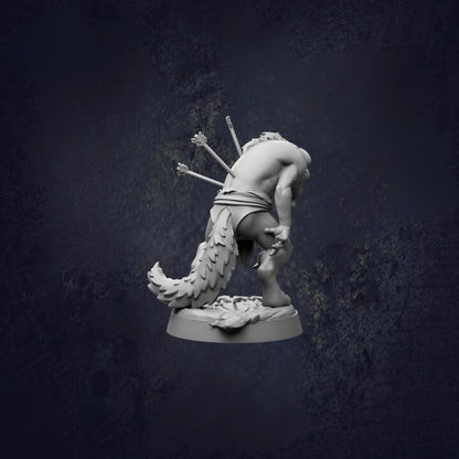 A statue of a winged creature with a long tail, standing on a base and facing away from the camera.