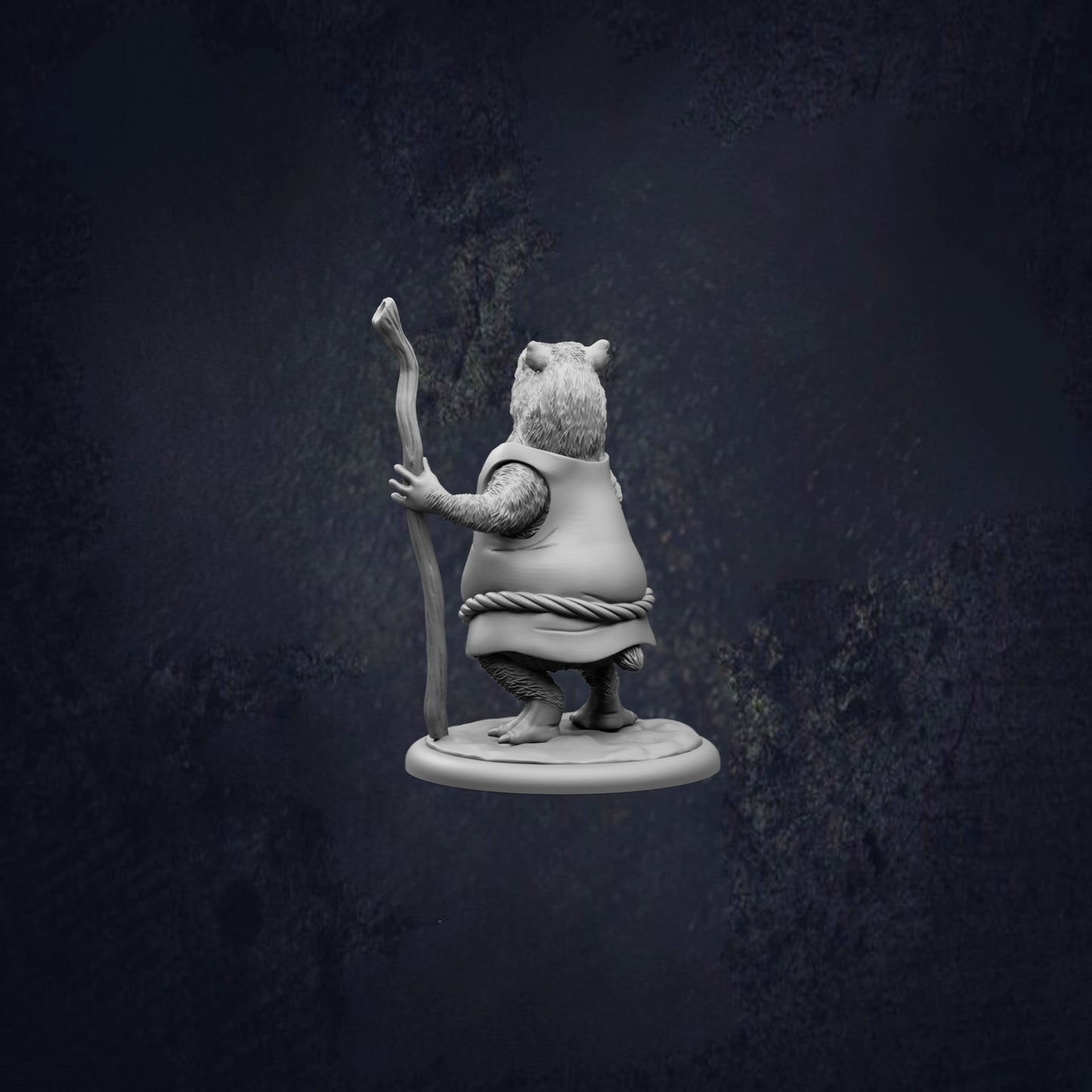 A small statue of a bear holding a stick and standing on a platform against a dark background.