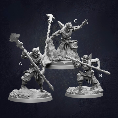 three figurines of characters, each with unique poses and weapons, set against a dark background.