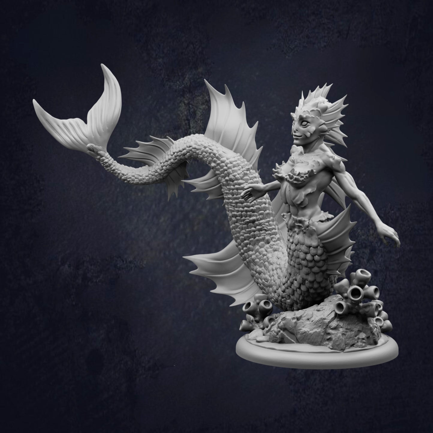 A detailed 3D model of a mermaid-like creature with a tail-like body, fins, and a head with a large, expressive face. The creature appears to be underwater, surrounded by coral or other marine life.