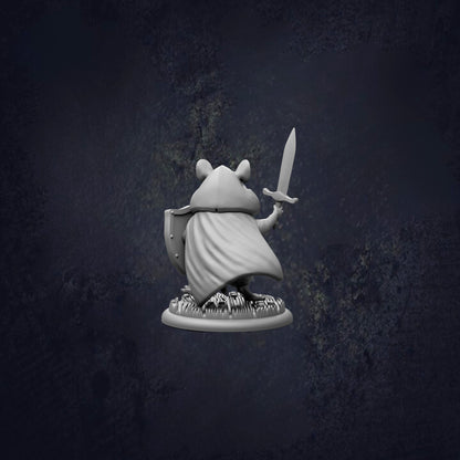 A white figurine of a person holding a sword and shield, standing on a base with a dark background.