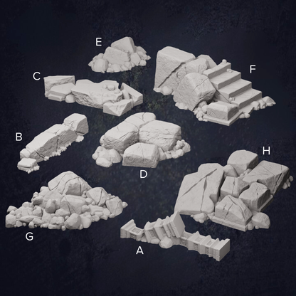 various rock formations and boulders, including a pile of rocks, a rocky cliff, and a set of stairs.