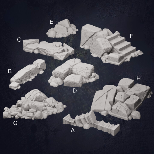various rock formations and boulders, including a pile of rocks, a rocky cliff, and a set of stairs.
