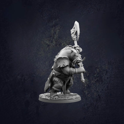 A 3D model of a warrior figure holding a large weapon, standing on a base against a dark background.